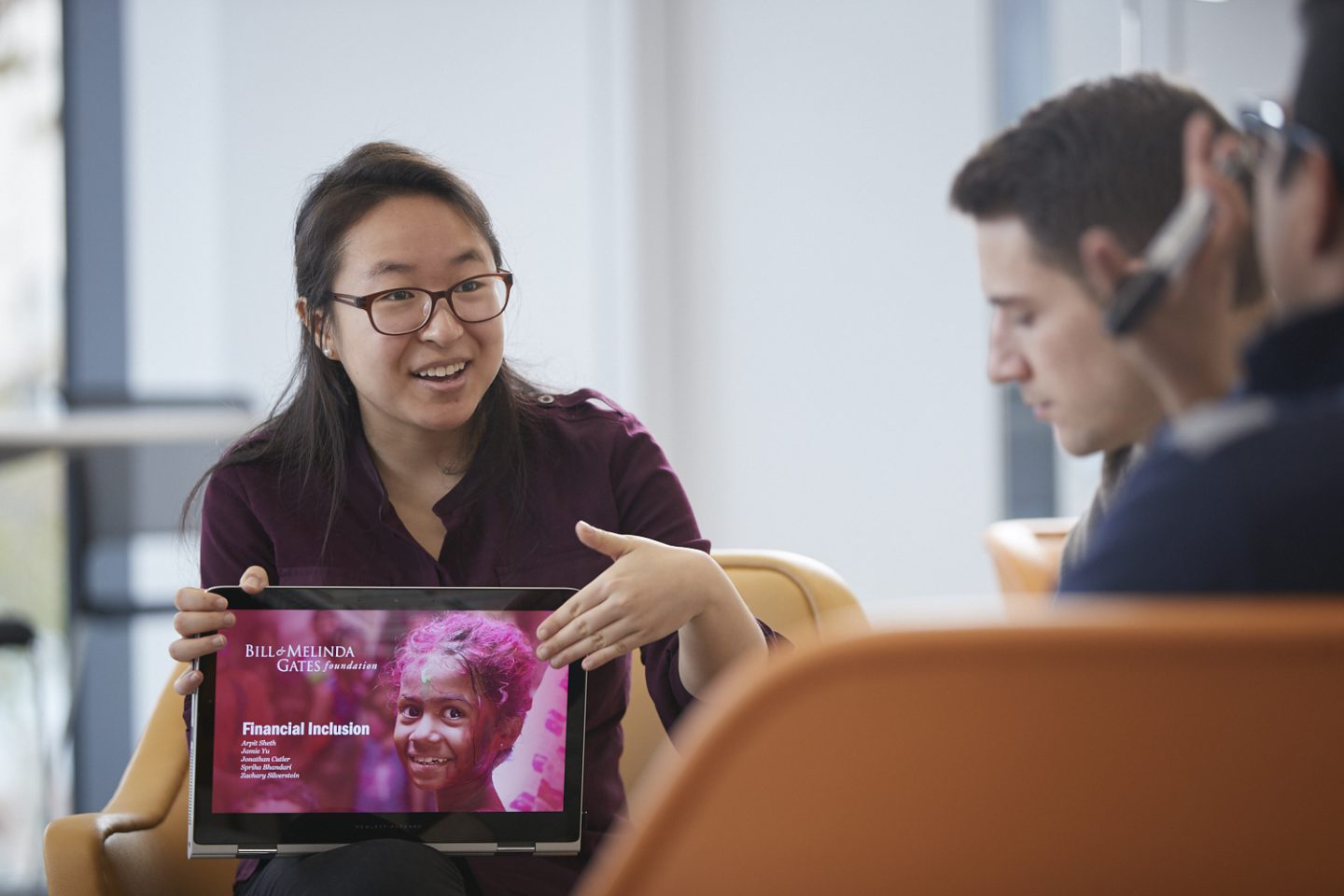 A woman pointing to her tablet screen
