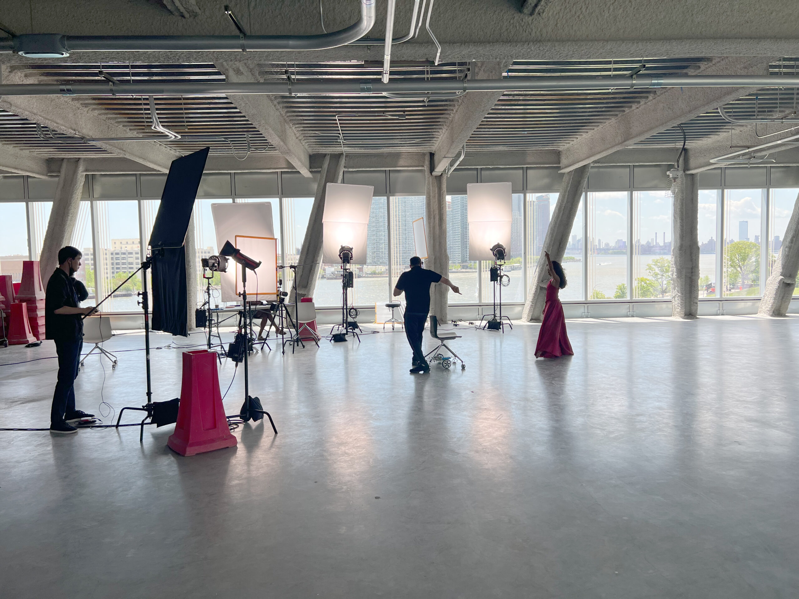 (L-R) Cornell Tech PhD student Fanjun Bu controls a robotic chair while Ballet Hispánico’s Artistic Director and CEO Eduardo Vilaro choreographs company dancer Dandara Veiga inside the Tata Innovation Center, Cornell Tech campus. 